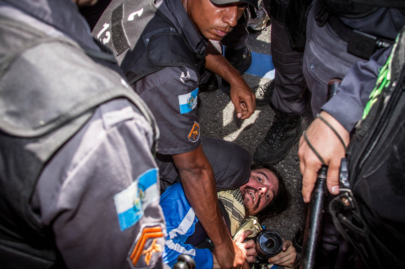A photojournalist was arrested for being suspected of throwing a beer can at a police car during the Independance Day celebrations, on Avenida Presidente Vargas in Rio de Janeiro. Photo Marcio Isensee e Sá copyright Demotix (07/09/2013)